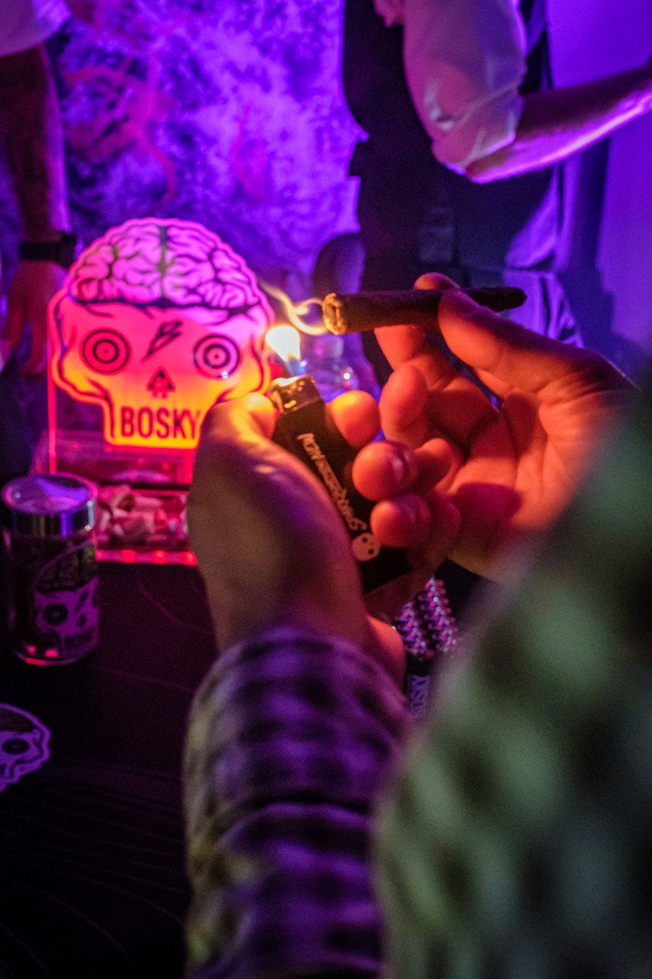 Bosky Genetics product under the neon skull sign